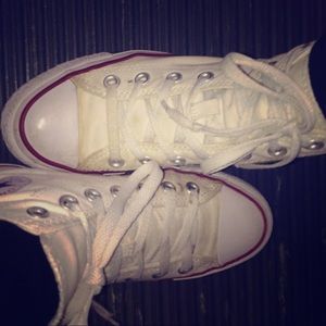 Higher top, white converse sneakers.